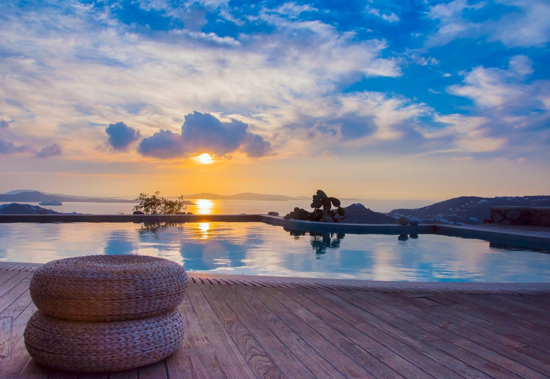 'The reflection of the beautiful clouds in the pool at sunset and the island ... Greece.' - Σαντορίνη